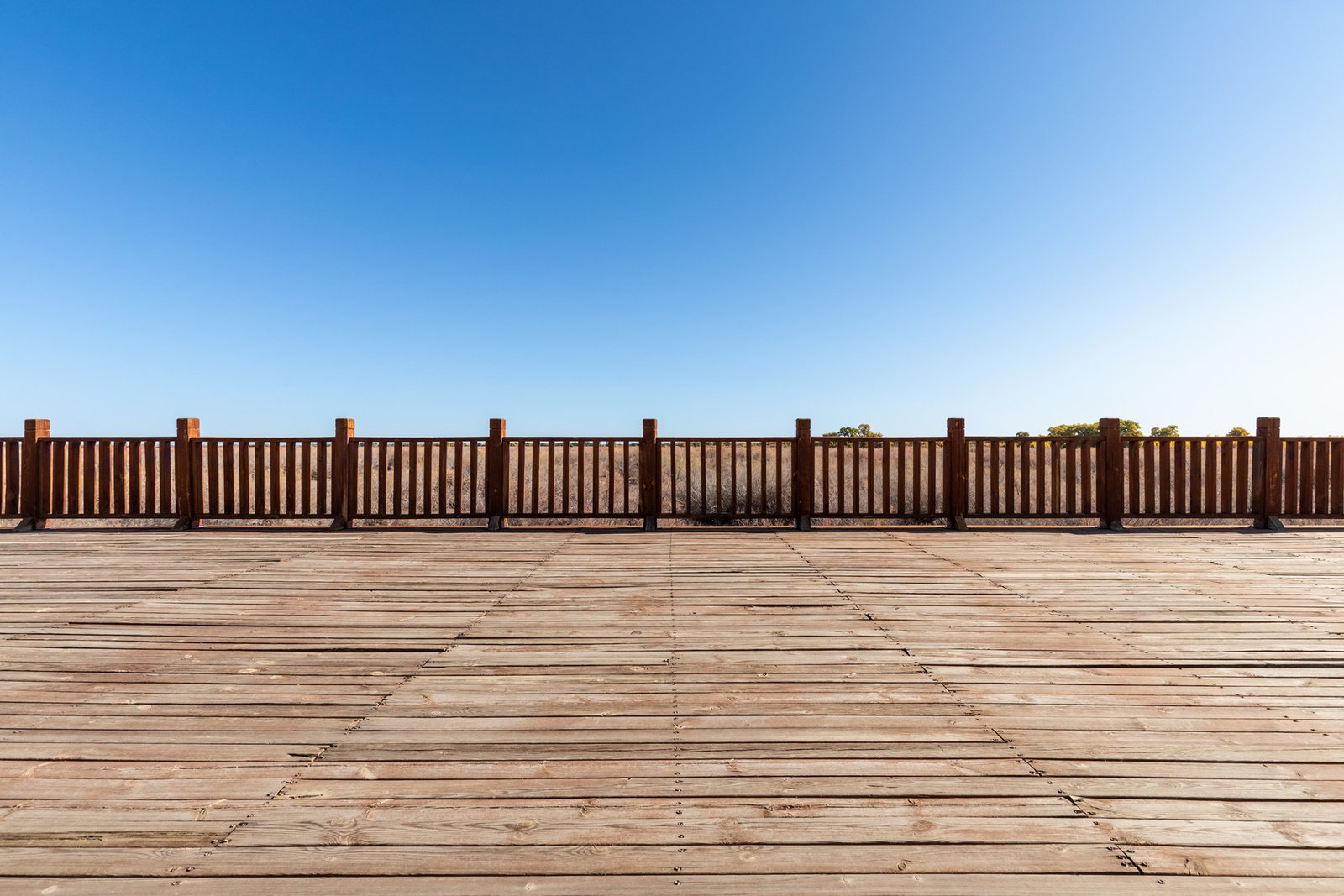 wood-floor-and-wooden-railings-in-outdoor-park-2023-11-27-05-12-46-utc